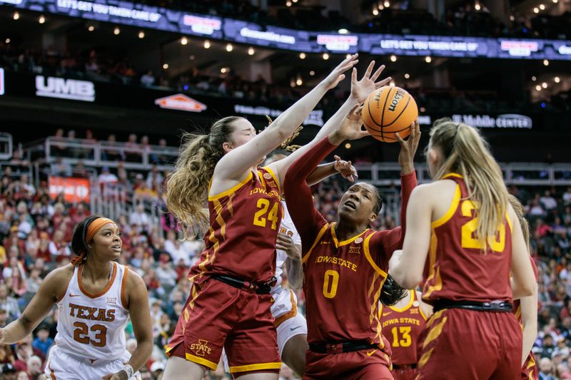 Mar 12, 2024; Kansas City, MO, USA; Iowa State Cyclones center Isnelle Natabou (0) and Iowa State Cyclones forward Addy Brown (24) go after a rebound during the first half against the Texas Longhorns at T-Mobile Center. Mandatory Credit: William Purnell-USA TODAY Sports