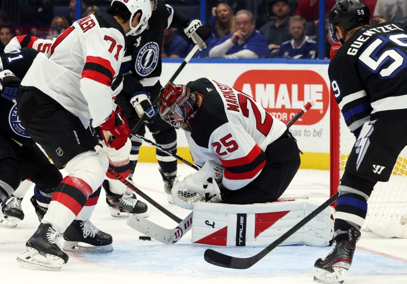 Oct 11, 2025; Tampa, Florida, USA; New Jersey Devils goaltender Jacob Markstrom (25) makes a save against the Tampa Bay Lightning during the third period at Benchmark International Arena. Mandatory Credit: Kim Klement Neitzel-Imagn Images