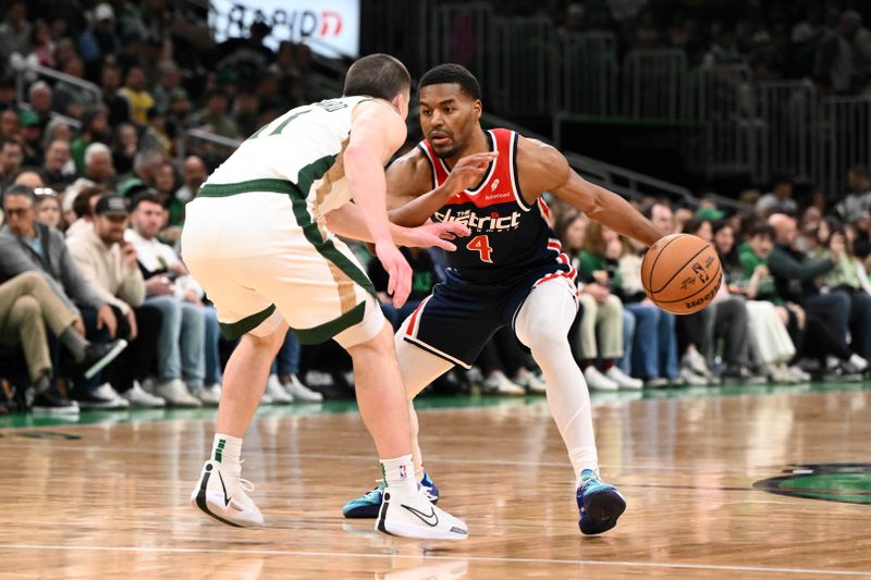 BOSTON, MASSACHUSETTS - APRIL 14: Jared Butler #4 of the Washington Wizards drives to the basket against Payton Pritchard #11 of the Boston Celtics during the second quarter at the TD Garden on April 14, 2024 in Boston, Massachusetts. NOTE TO USER: User expressly acknowledges and agrees that, by downloading and or using this photograph, User is consenting to the terms and conditions of the Getty Images License Agreement. (Photo by Brian Fluharty/Getty Images)