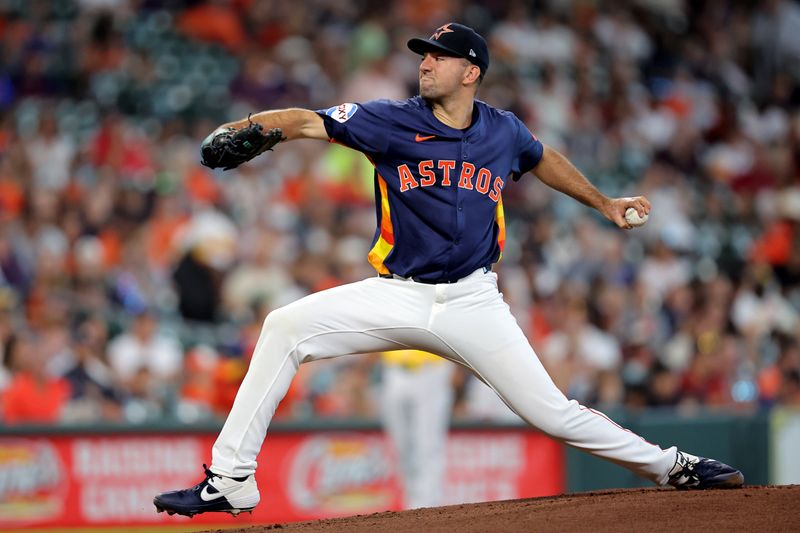 Jul 27, 2025; Houston, Texas, USA; Houston Astros starting pitcher Colton Gordon (61) delivers a pitch against the Athletics during the first inning at Daikin Park. Mandatory Credit: Erik Williams-Imagn Images