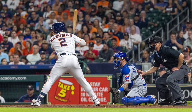 May 16, 2023; Houston, Texas, USA; Houston Astros third baseman Alex Bregman (2) gets hit in the foot by a pitch against the Chicago Cubs in the fourth inning at Minute Maid Park. Mandatory Credit: Thomas Shea-USA TODAY Sports