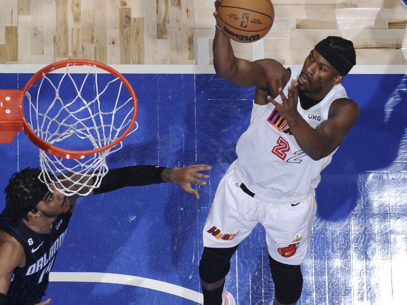 ORLANDO, FL - FEBRUARY 11: Jimmy Butler #22 of the Miami Heat drives to the basket during the game against the Orlando Magic on February 11, 2023 at Amway Center in Orlando, Florida. NOTE TO USER: User expressly acknowledges and agrees that, by downloading and or using this photograph, User is consenting to the terms and conditions of the Getty Images License Agreement. Mandatory Copyright Notice: Copyright 2023 NBAE (Photo by Fernando Medina/NBAE via Getty Images)