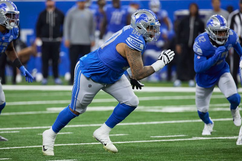 Detroit Lions defensive tackle Cory Durden (90) rushes on defense against the Jasksonville Jaguars during an NFL pre-season football game, Saturday, Aug. 19, 2023, in Detroit. (AP Photo/Rick Osentoski)