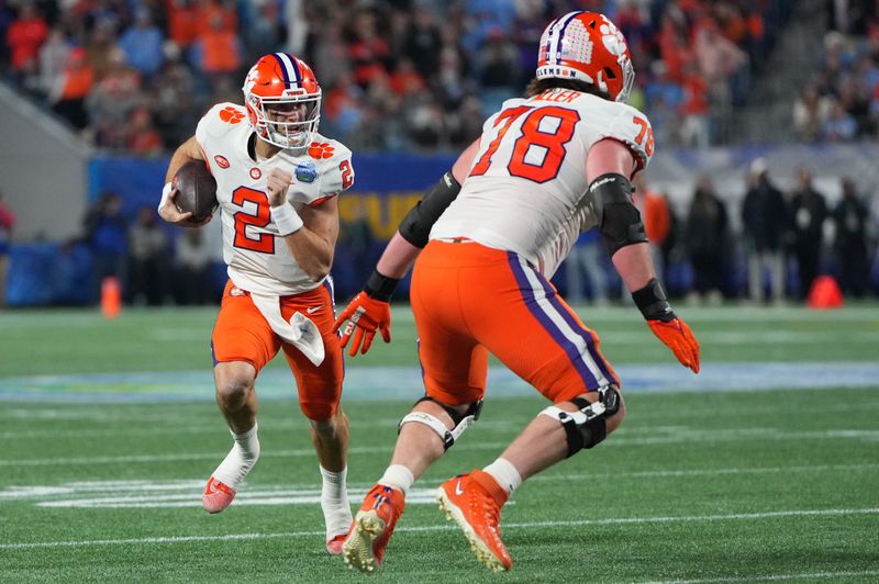 Dec 3, 2022; Charlotte, North Carolina, USA; Clemson Tigers quarterback Cade Klubnik (2) runs during the first quarter of the ACC Championship game against the North Carolina Tar Heels at Bank of America Stadium. Mandatory Credit: Bob Donnan-USA TODAY Sports