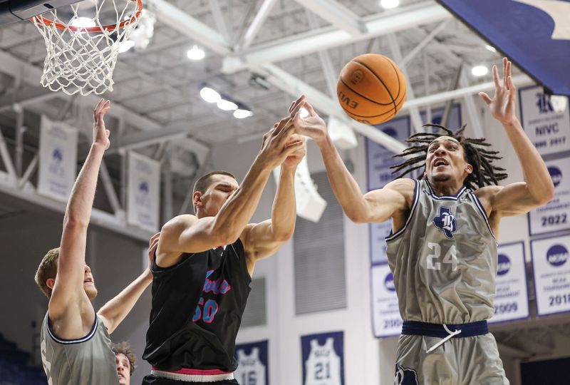 Jan 24, 2024; Houston, Texas, USA; Florida Atlantic Owls center Vladislav Goldin (50) and Rice Owls forward Keanu Dawes (24) battle for a loose ball during the first half at Tudor Fieldhouse. Mandatory Credit: Troy Taormina-USA TODAY Sports