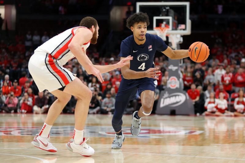 Jan 20, 2024; Columbus, Ohio, USA;  Penn State Nittany Lions forward Puff Johnson (4) dribbles the basketball as Ohio State Buckeyes forward Jamison Battle (10) defends during the first half at Value City Arena. Mandatory Credit: Joseph Maiorana-USA TODAY Sports