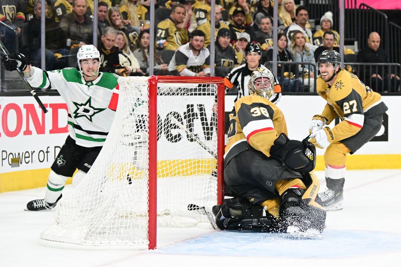 Apr 27, 2024; Las Vegas, Nevada, USA; Vegas Golden Knights goaltender Logan Thompson (36) reacts to being scored on Dallas Stars center Wyatt Johnston (53) in overtime in game three of the first round of the 2024 Stanley Cup Playoffs at T-Mobile Arena. Mandatory Credit: Candice Ward-USA TODAY Sports