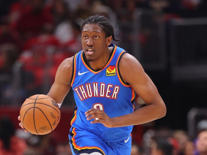 CHICAGO, ILLINOIS - OCTOBER 25: Jalen Williams #8 of the Oklahoma City Thunder dribbles against the Chicago Bulls during the first half at the United Center on October 25, 2023 in Chicago, Illinois. NOTE TO USER: User expressly acknowledges and agrees that, by downloading and or using this photograph, User is consenting to the terms and conditions of the Getty Images License Agreement. (Photo by Michael Reaves/Getty Images)