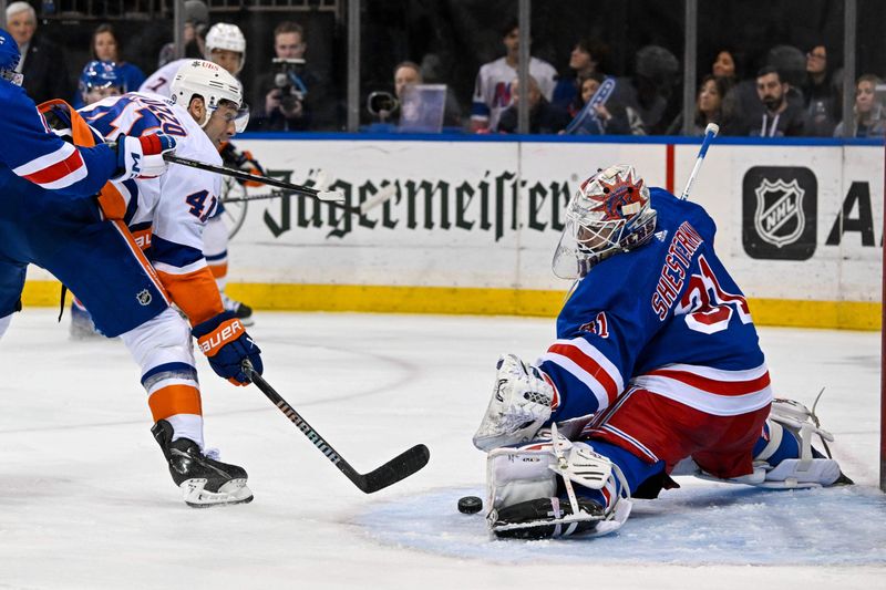 Apr 13, 2024; New York, New York, USA;  New York Rangers goaltender Igor Shesterkin (31) makes a save on New York Islanders defenseman Robert Bortuzzo (41) during the third period at Madison Square Garden. Mandatory Credit: Dennis Schneidler-USA TODAY Sports