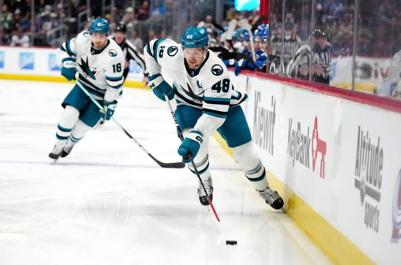 Dec 31, 2023; Denver, Colorado, USA; San Jose Sharks center Tomas Hertl (48) controls the puck in the first period against the Colorado Avalanche at Ball Arena. Mandatory Credit: Ron Chenoy-USA TODAY Sports