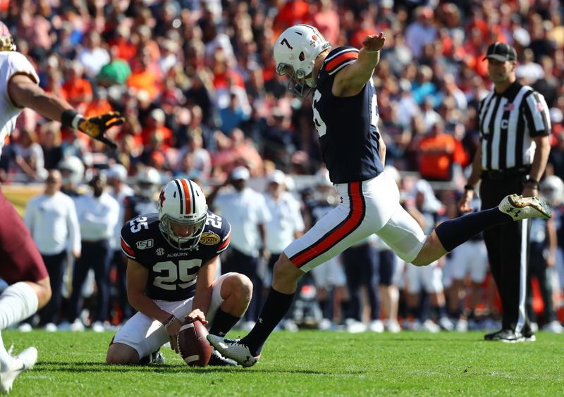 Jan 1, 2020; Tampa, Florida, USA; Auburn Tigers place kicker Anders Carlson (26) makes a field goal against the Minnesota Golden Gophers during the first quarter at Raymond James Stadium. Mandatory Credit: Kim Klement-USA TODAY Sports