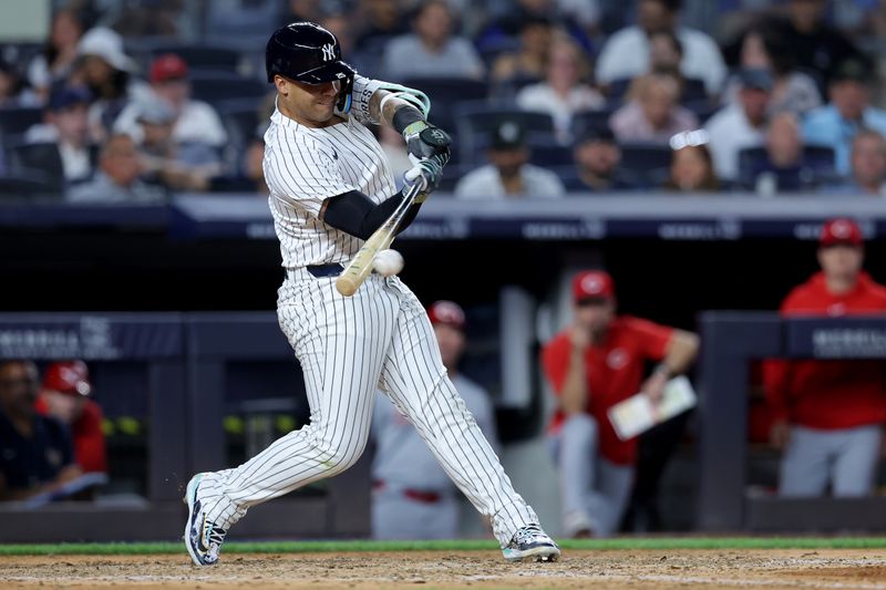 Jul 2, 2024; Bronx, New York, USA; New York Yankees second baseman Gleyber Torres (25) hits an RBI single against the Cincinnati Reds during the sixth inning at Yankee Stadium. Mandatory Credit: Brad Penner-USA TODAY Sports