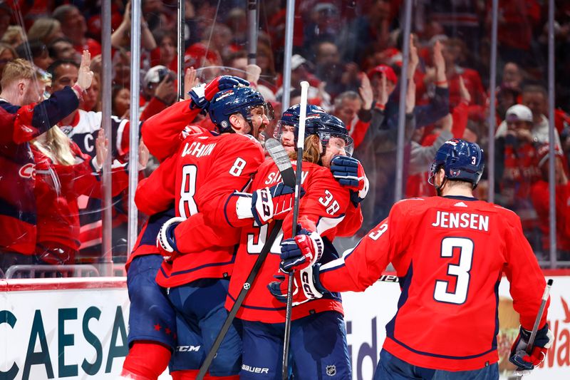 Mar 24, 2024; Washington, District of Columbia, USA; Washington Capitals left wing Alex Ovechkin (8) celebrates with teammates after scoring a goal during the third period against the Winnipeg Jets at Capital One Arena. Mandatory Credit: Amber Searls-USA TODAY Sports