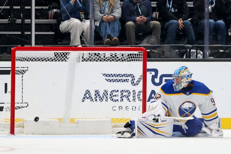 Nov 12, 2025; Salt Lake City, Utah, USA; The Utah Mammoth score on Buffalo Sabres goaltender Colten Ellis (92) during the second period at Delta Center. Mandatory Credit: Rob Gray-Imagn Images