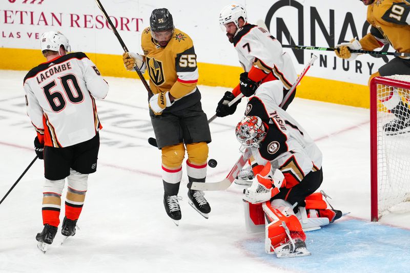 Apr 18, 2024; Las Vegas, Nevada, USA; Anaheim Ducks goaltender Lukas Dostal (1) makes a save after a shot deflects off Vegas Golden Knights right wing Keegan Kolesar (55) during the third period at T-Mobile Arena. Mandatory Credit: Stephen R. Sylvanie-USA TODAY Sports