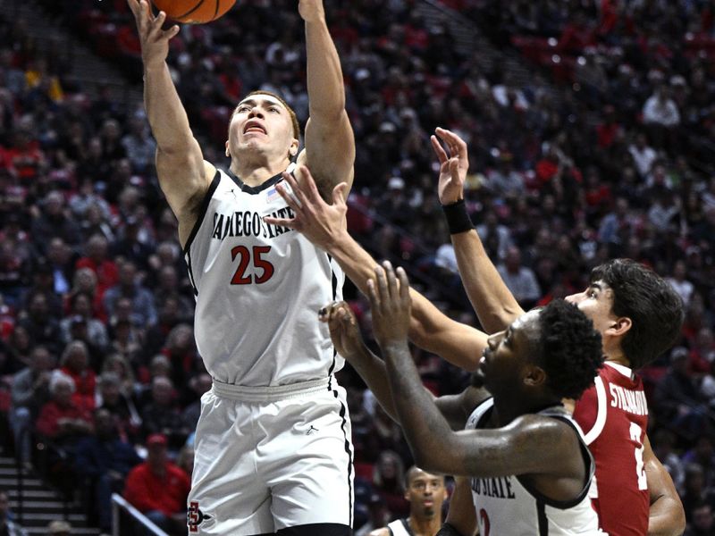 Dec 21, 2023; San Diego, California, USA; San Diego State Aztecs forward Elijah Saunders (25) grabs a rebound during the second half against the Stanford Cardinal at Viejas Arena. Mandatory Credit: Orlando Ramirez-USA TODAY Sports