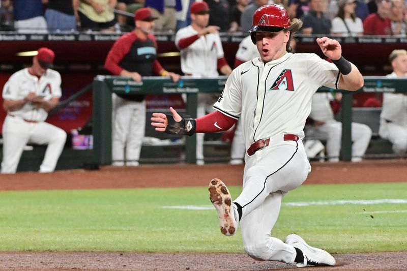 Sep 25, 2024; Phoenix, Arizona, USA; Arizona Diamondbacks outfielder Jake McCarthy (31) scores in the second inning against the San Francisco Giants at Chase Field. Mandatory Credit: Matt Kartozian-Imagn Images