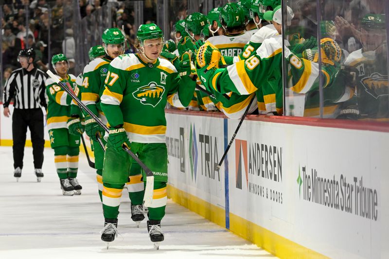 Nov 1, 2024; Saint Paul, Minnesota, USA;  Minnesota Wild forward Kirill Kaprizov (97) celebrates his empty net goal against the Tampa Bay Lightning during the third period at Xcel Energy Center. Mandatory Credit: Nick Wosika-Imagn Images