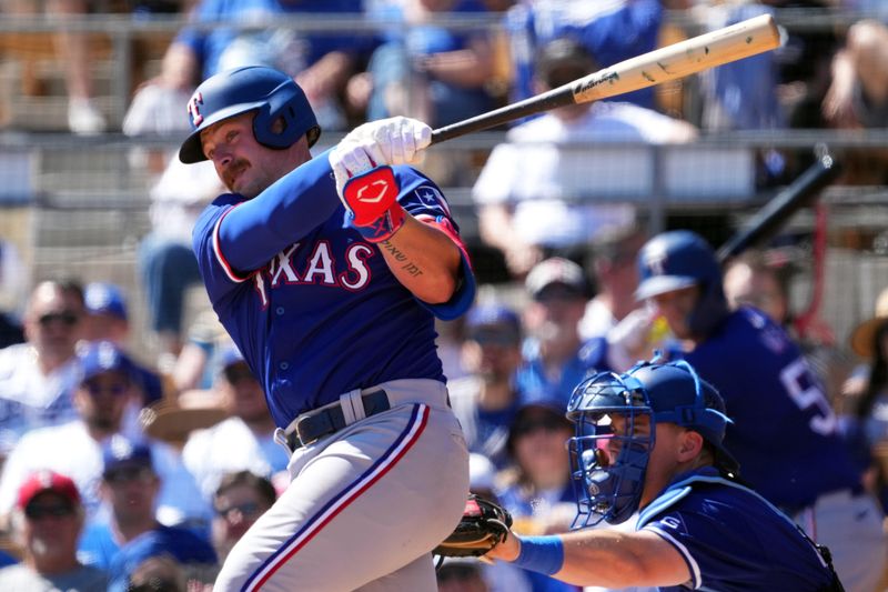 Mar 9, 2024; Phoenix, Arizona, USA; Texas Rangers first baseman Blaine Crim (74) bats against the Los Angeles Dodgers during the second inning at Camelback Ranch-Glendale. Mandatory Credit: Joe Camporeale-USA TODAY Sports