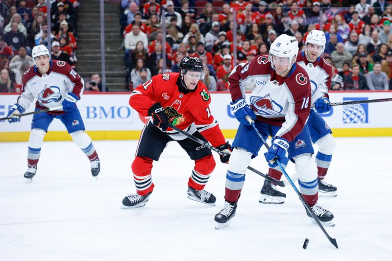 Nov 23, 2025; Chicago, Illinois, USA; Colorado Avalanche center Jack Drury (18) controls the puck against the Chicago Blackhawks during the first period at United Center. Mandatory Credit: Kamil Krzaczynski-Imagn Images