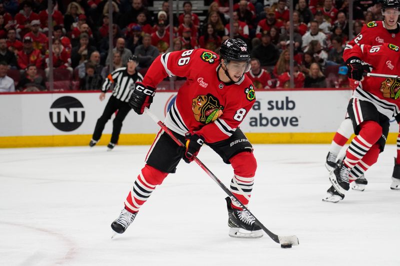 Nov 6, 2024; Chicago, Illinois, USA; Chicago Blackhawks center Teuvo Teravainen (86) moves the puck against the Detroit Red Wings during the second period at United Center. Mandatory Credit: David Banks-Imagn Images