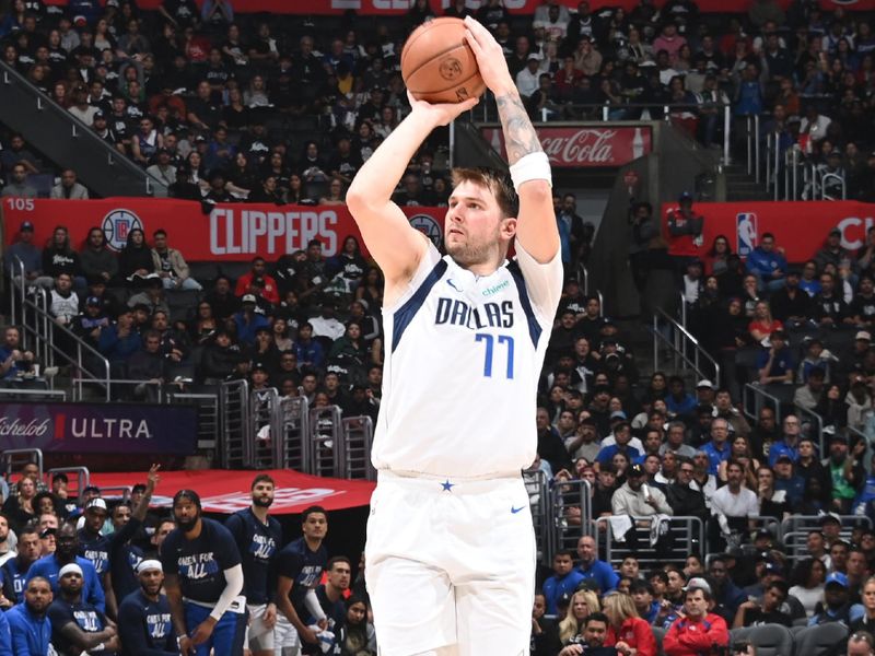 LOS ANGELES, CA - APRIL 23: Luka Doncic #77 of the Dallas Mavericks shoots a three point basket against the LA Clippers during Round 1 Game 2 of the 2024 NBA Playoffs on April 23, 2024 at Crypto.Com Arena in Los Angeles, California. NOTE TO USER: User expressly acknowledges and agrees that, by downloading and/or using this Photograph, user is consenting to the terms and conditions of the Getty Images License Agreement. Mandatory Copyright Notice: Copyright 2024 NBAE (Photo by Andrew D. Bernstein/NBAE via Getty Images)