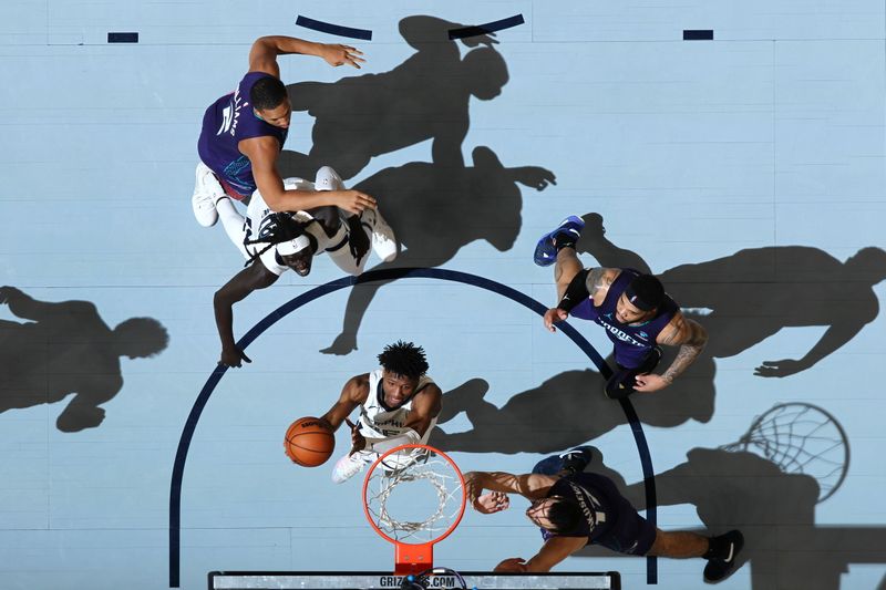 MEMPHIS, TN - MARCH 13: GG Jackson #45 of the Memphis Grizzlies drives to the basket during the game against the Charlotte Hornets on March 13, 2024 at FedExForum in Memphis, Tennessee. NOTE TO USER: User expressly acknowledges and agrees that, by downloading and or using this photograph, User is consenting to the terms and conditions of the Getty Images License Agreement. Mandatory Copyright Notice: Copyright 2024 NBAE (Photo by Joe Murphy/NBAE via Getty Images)