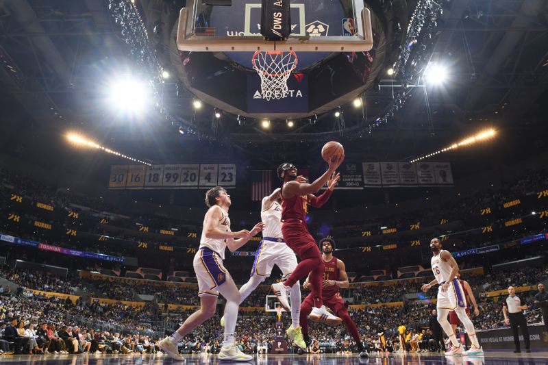 LOS ANGELES, CA - APRIL 6: Donovan Mitchell #45 of the Cleveland Cavaliers drives to the basket during the game against the Cleveland Cavaliers on April 6, 2024 at Crypto.Com Arena in Los Angeles, California. NOTE TO USER: User expressly acknowledges and agrees that, by downloading and/or using this Photograph, user is consenting to the terms and conditions of the Getty Images License Agreement. Mandatory Copyright Notice: Copyright 2024 NBAE (Photo by Adam Pantozzi/NBAE via Getty Images)