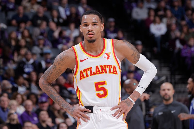 SACRAMENTO, CA - JANUARY 22: Dejounte Murray #5 of the Atlanta Hawks looks on during the game against the Sacramento Kings on January 22, 2024 at Golden 1 Center in Sacramento, California. NOTE TO USER: User expressly acknowledges and agrees that, by downloading and or using this Photograph, user is consenting to the terms and conditions of the Getty Images License Agreement. Mandatory Copyright Notice: Copyright 2024 NBAE (Photo by Rocky Widner/NBAE via Getty Images)