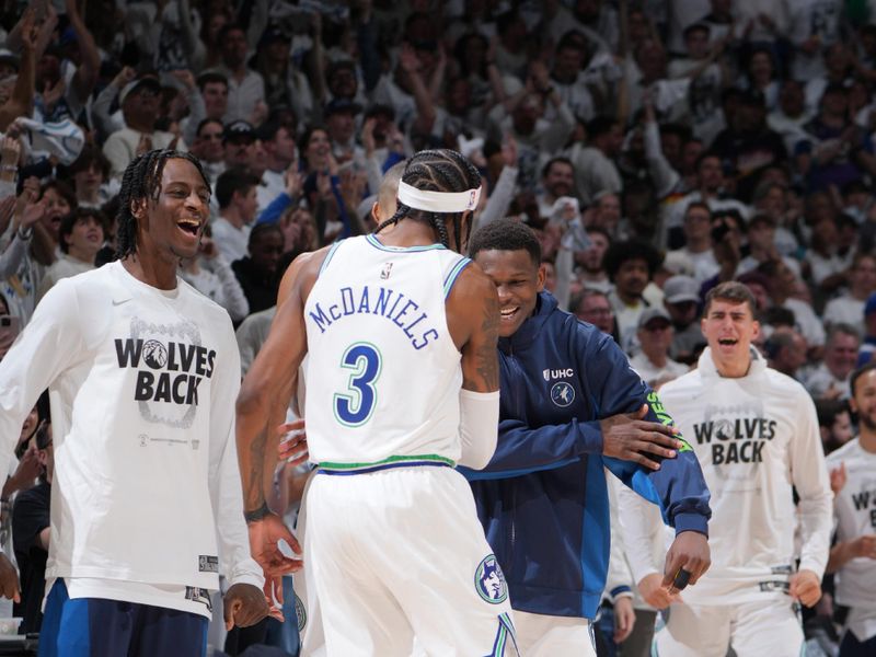 MINNEAPOLIS, MN -  APRIL 23: The Minnesota Timberwolves celebrate a play by Jaden McDaniels #3 during the game against the Phoenix Suns during Round One Game Two of the 2024 NBA Playoffs on April 23, 2024 at Target Center in Minneapolis, Minnesota. NOTE TO USER: User expressly acknowledges and agrees that, by downloading and or using this Photograph, user is consenting to the terms and conditions of the Getty Images License Agreement. Mandatory Copyright Notice: Copyright 2024 NBAE (Photo by Jordan Johnson/NBAE via Getty Images)