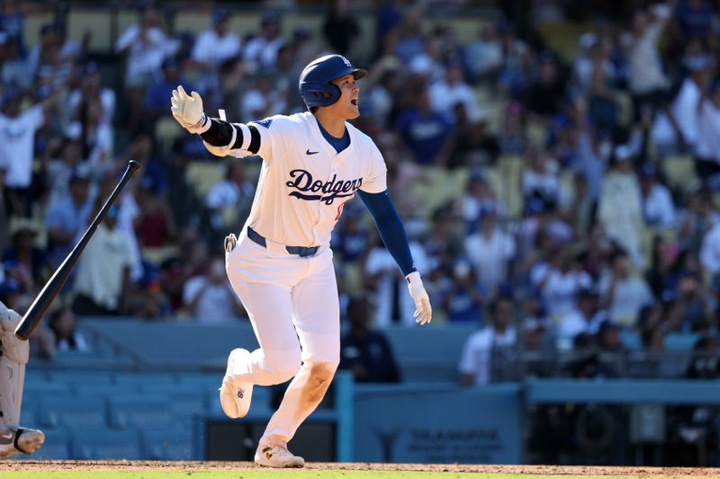 Sep 22, 2024; Los Angeles, California, USA;  Los Angeles Dodgers designated hitter Shohei Ohtani (17) hits a home run during the ninth inning against the Colorado Rockies at Dodger Stadium. Mandatory Credit: Kiyoshi Mio-Imagn Images