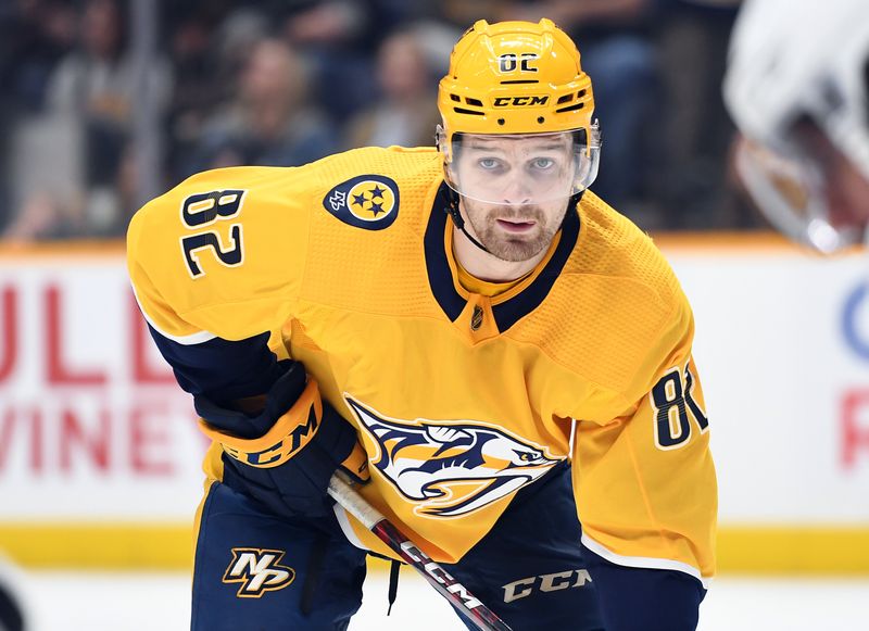 Jan 21, 2023; Nashville, Tennessee, USA; Nashville Predators center Tommy Novak (82) waits for a face off during the third period against the Los Angeles Kings at Bridgestone Arena. Mandatory Credit: Christopher Hanewinckel-USA TODAY Sports