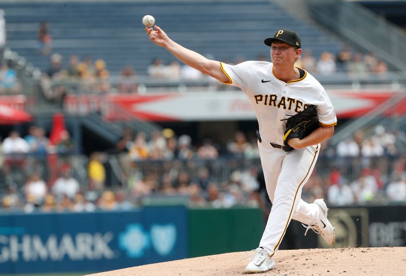 Jun 19, 2024; Pittsburgh, Pennsylvania, USA;  Pittsburgh Pirates starting pitcher Mitch Keller (23) delivers a pitch against the Cincinnati Reds during the first inning at PNC Park. Mandatory Credit: Charles LeClaire-USA TODAY Sports