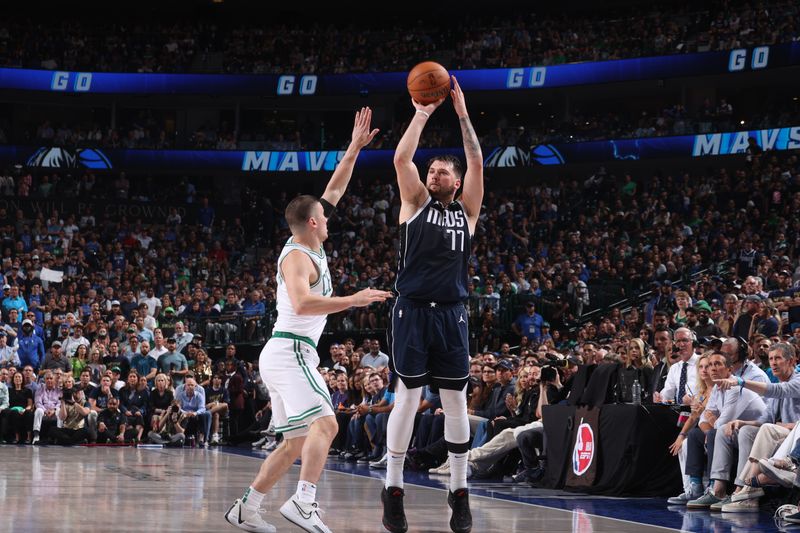 DALLAS, TX - JUNE 14: Luka Doncic #77 of the Dallas Mavericks shoots a three point basket during the game  against the Boston Celtics during Game 4 of the 2024 NBA Finals on June 14, 2024 at the American Airlines Center in Dallas, Texas. NOTE TO USER: User expressly acknowledges and agrees that, by downloading and or using this photograph, User is consenting to the terms and conditions of the Getty Images License Agreement. Mandatory Copyright Notice: Copyright 2024 NBAE (Photo by Nathaniel S. Butler/NBAE via Getty Images)