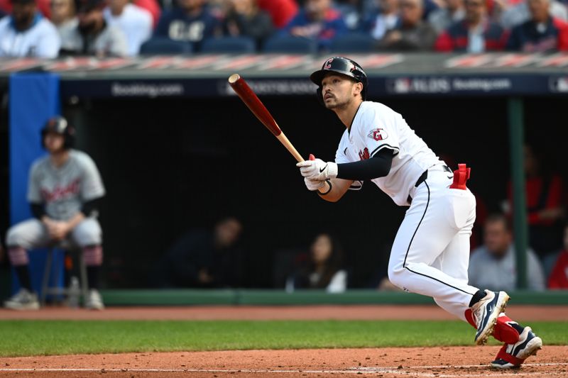 Oct 12, 2024; Cleveland, Ohio, USA; Cleveland Guardians outfielder Steven Kwan (38) hits a double in the third inning against the Detroit Tigers during game five of the ALDS for the 2024 MLB Playoffs at Progressive Field. Mandatory Credit: Ken Blaze-Imagn Images