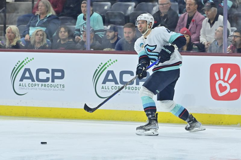 Nov 7, 2023; Tempe, Arizona, USA; Seattle Kraken defenseman Justin Schultz (4) passes the puck in the second period against the Arizona Coyotes at Mullett Arena. Mandatory Credit: Matt Kartozian-USA TODAY Sports