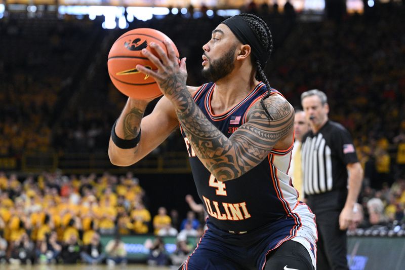Jan 11, 2026; Iowa City, Iowa, USA; Illinois Fighting Illini guard Kylan Boswell (4) controls the ball against the Iowa Hawkeyes during the first half at Carver-Hawkeye Arena. Mandatory Credit: Jeffrey Becker-Imagn Images