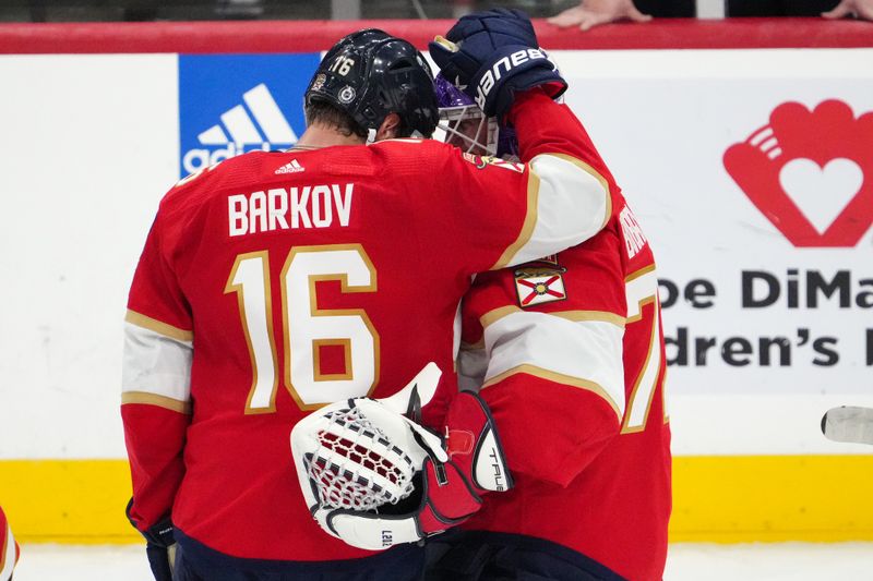 Nov 10, 2023; Sunrise, Florida, USA; Florida Panthers center Aleksander Barkov (16) celebrates with goaltender Sergei Bobrovsky (72) after defeating the Carolina Hurricanes at Amerant Bank Arena. Mandatory Credit: Jasen Vinlove-USA TODAY Sports