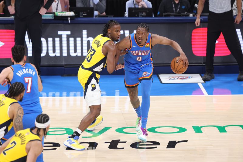 OKLAHOMA CITY, OK - JUNE 8: Jalen Williams #8 of the Oklahoma City Thunder dribbles the ball during the game against the Indiana Pacers during Game 2 of the 2025 NBA Finals on June 8, 2025 at Paycom Center in Oklahoma City, Oklahoma. NOTE TO USER: User expressly acknowledges and agrees that, by downloading and or using this photograph, User is consenting to the terms and conditions of the Getty Images License Agreement. Mandatory Copyright Notice: Copyright 2025 NBAE (Photo by Joe Murphy/NBAE via Getty Images)