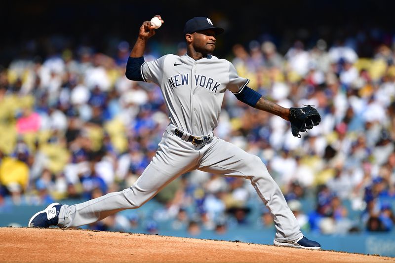 Jun 4, 2023; Los Angeles, California, USA; New York Yankees starting pitcher Domingo German (0) throws against the Los Angeles Dodgers during the first inning at Dodger Stadium. Mandatory Credit: Gary A. Vasquez-USA TODAY Sports