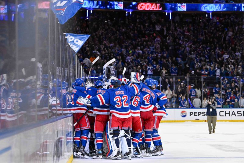 Apr 13, 2024; New York, New York, USA;  New York Rangers celebrate their victory over the New York Islanders after the game at Madison Square Garden. Mandatory Credit: Dennis Schneidler-USA TODAY Sports