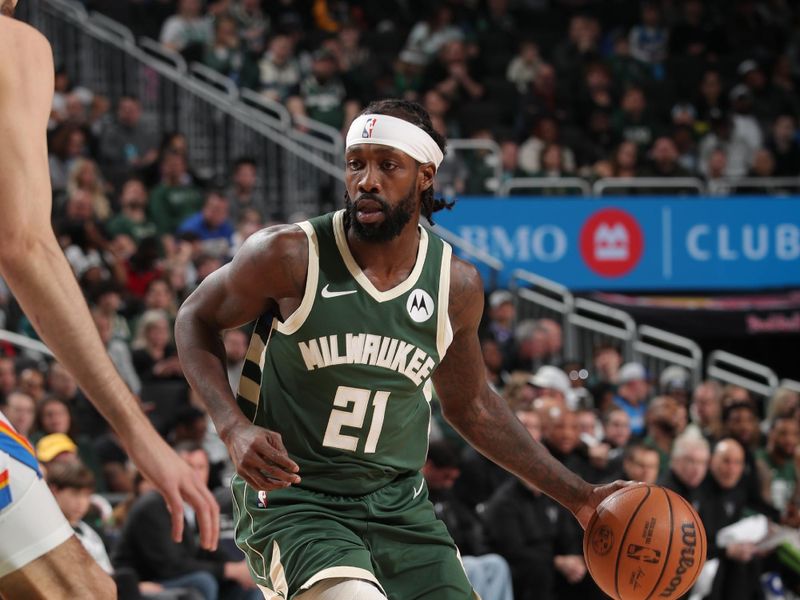 MILWAUKEE, WI - MARCH 24: Patrick Beverley #21 of the Milwaukee Bucks handles the ball during the game against the Oklahoma City Thunder on March 24, 2024 at the Fiserv Forum Center in Milwaukee, Wisconsin. NOTE TO USER: User expressly acknowledges and agrees that, by downloading and or using this Photograph, user is consenting to the terms and conditions of the Getty Images License Agreement. Mandatory Copyright Notice: Copyright 2024 NBAE (Photo by Gary Dineen/NBAE via Getty Images).