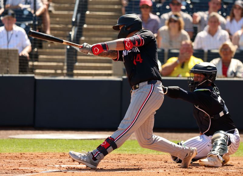 Feb 26, 2024; Tampa, Florida, USA; Minnesota Twins third baseman Jose Miranda (64) hits a RBI during the third inning against the New York Yankees  at George M. Steinbrenner Field. Mandatory Credit: Kim Klement Neitzel-USA TODAY Sports