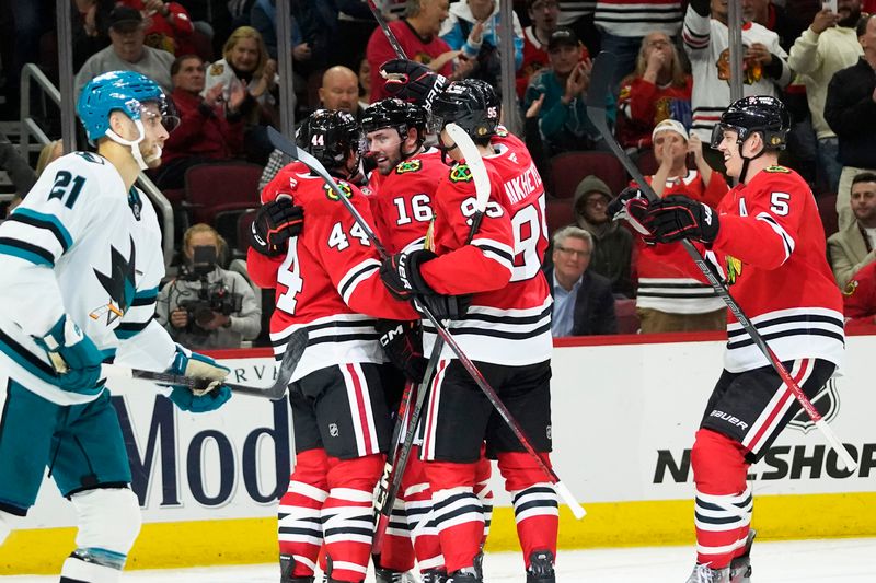 Oct 17, 2024; Chicago, Illinois, USA; Chicago Blackhawks center Jason Dickinson (16) celebrates his goal against the San Jose Sharks during the third period at United Center. Mandatory Credit: David Banks-Imagn Images