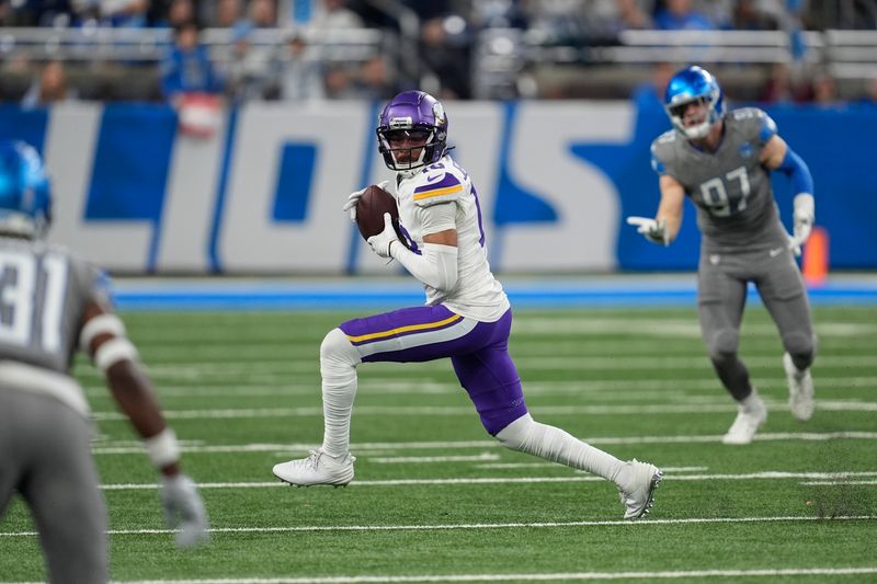 Minnesota Vikings wide receiver Justin Jefferson (18) runs after a catch Detroit Lions in the first half of an NFL football game in Detroit, Sunday, Jan. 7, 2024. (AP Photo/Paul Sancya)