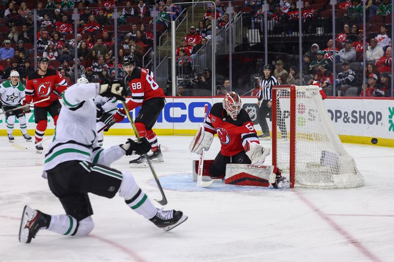 Jan 20, 2024; Newark, New Jersey, USA; New Jersey Devils goaltender Nico Daws (50) makes a save against the Dallas Stars during the third period at Prudential Center. Mandatory Credit: Ed Mulholland-USA TODAY Sports