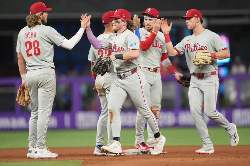 Sep 6, 2025; Miami, Florida, USA;  The Philadelphia Phillies celebrate a victory over the Miami Marlins at loanDepot Park. Mandatory Credit: Jim Rassol-Imagn Images