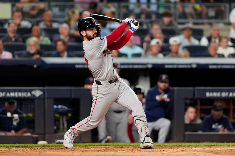 Sep 12, 2024; Bronx, New York, USA; Boston Red Sox first baseman Connor Wong (12) hits a double against the New York Yankees during the second inning at Yankee Stadium. Mandatory Credit: Gregory Fisher-Imagn Images