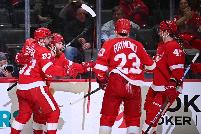 Apr 5, 2024; Detroit, Michigan, USA; Detroit Red Wings left wing J.T. Compher (37) celebrates his goal with left wing David Perron (57) left wing Lucas Raymond (23) and defenseman Jeff Petry (46) during the second period against the New York Rangers at Little Caesars Arena. Mandatory Credit: Tim Fuller-USA TODAY Sports