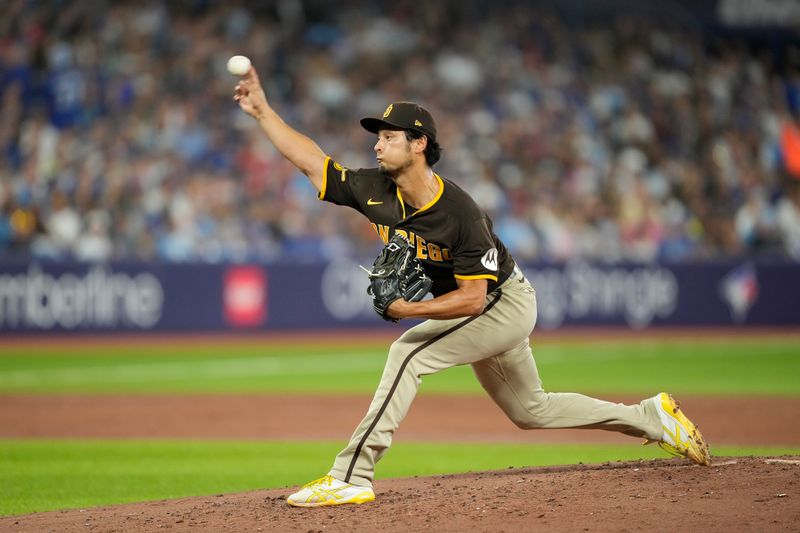 Jul 19, 2023; Toronto, Ontario, CAN; San Diego Padres starting pitcher Yu Darvish (11) pitches to the Toronto Blue Jays during the second inning at Rogers Centre. Mandatory Credit: John E. Sokolowski-USA TODAY Sports